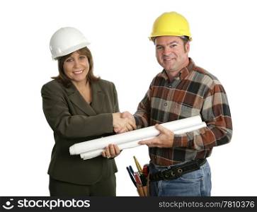 A female engineer and a building contractor shaking hands. Isolated on white.