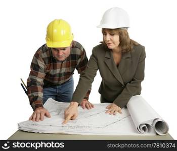A female engineer going over the blueprints with a building contractor. Isolated on white.