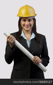 A female engineer with blueprints