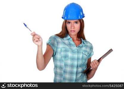 A female foreman with a clipboard.