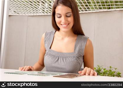 A female interior architect looking at glass tile swatches
