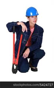 A female manual worker with pliers.