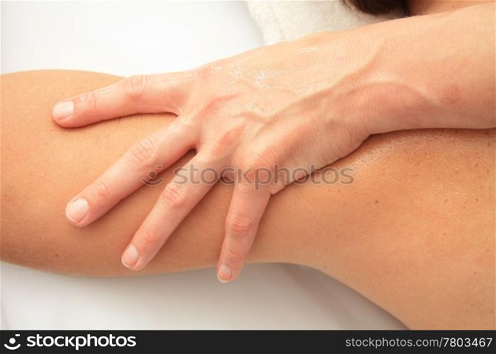 A female masseur giving massage, detail of arm