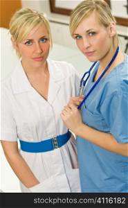 A female nurse with her surgical colleague, the ocus is mainly on the doctor in blue scrubs