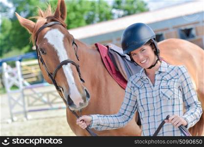 a female rider and her horse