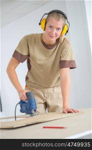 a female worker carpenter posing