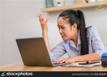 A female worker uses a laptop and thinks of solving problems in the office.
