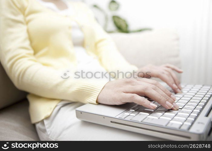 A Female works on a PC