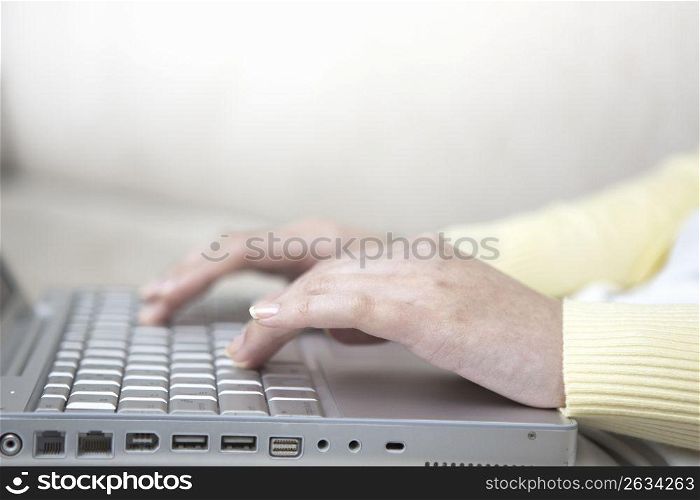 A Female works on a PC