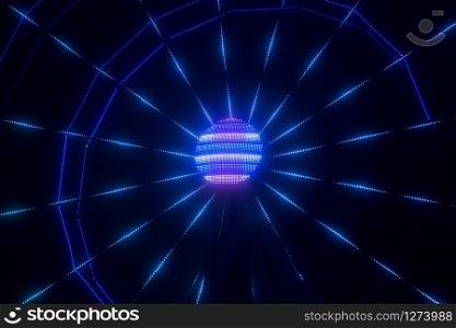 A ferris wheel illuminated at night