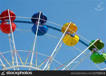a ferris wheel in blue sky - horizontal shot