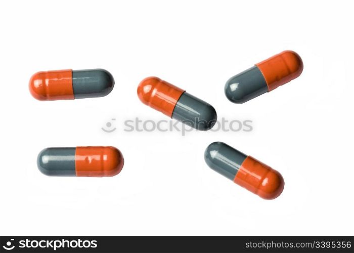 A few capsules isolated on white background