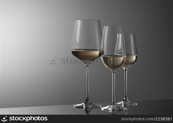 a few glasses of wine on a light background. wine glasses on a light background