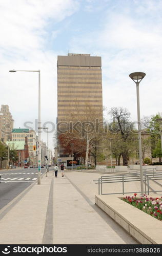 A few of a street of downtown Hamilton in the spring with some high rise buildings.
