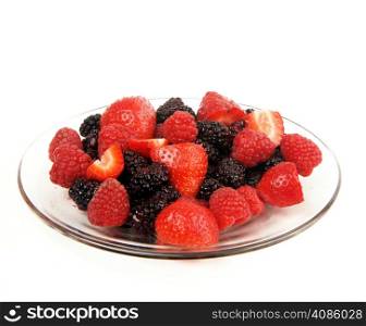 A few pieces of fruit on a glass plate