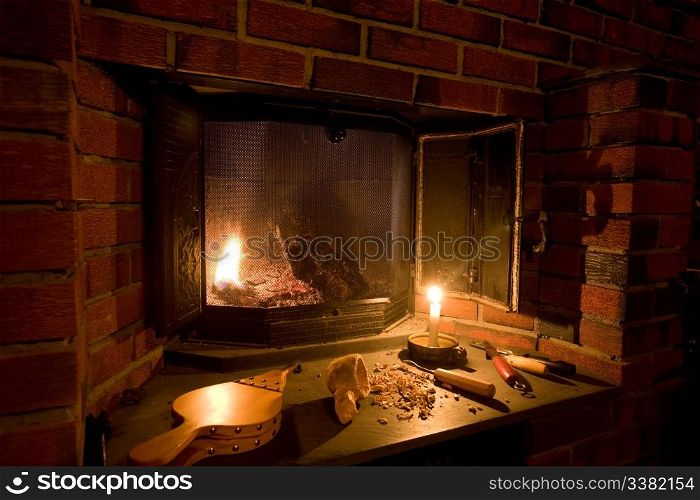 A fireplace scene in an old fashioned setting