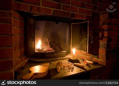 A fireplace scene in an old fashioned setting