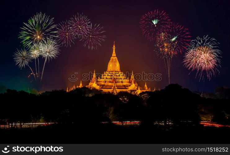 A fireworks in the evening skye. A temple at the middle of scene