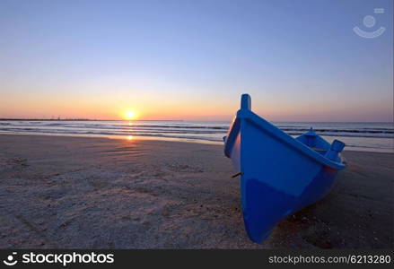 a fisherman boat at sunrise