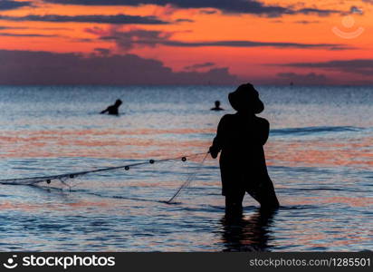 A fisherman is fishing at Sunset on Koh Rong. A fisherman is fishing at Sunset on Koh Rong, Cambodia