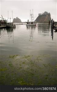 A fishing vessel pulls out after fueling up at the Marina in LaPush