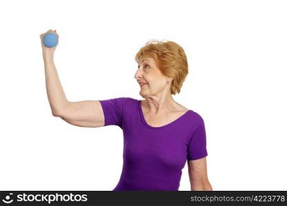 A fit healthy seventy year old woman working out with freeweights. Isolated on white.
