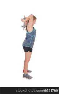 A fit slim woman standing isolated for white background andlifting her dumbbell?s over her head to exercise her strength