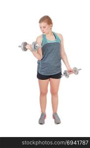 A fit young slim woman standing isolated for white background andlifting two dumbbell?s up to exercise her strength