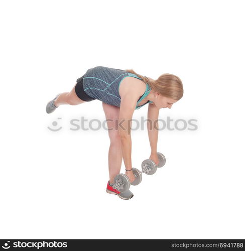 A fit young slim woman standing isolated for white background andlifting two dumbbell?s up to exercise her strength