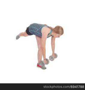 A fit young slim woman standing isolated for white background andlifting two dumbbell?s up to exercise her strength