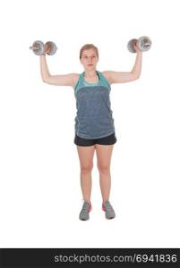A fit young slim woman standing isolated for white background andlifting two dumbbell?s up to exercise her strength