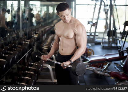 A fitness man work out in the gym