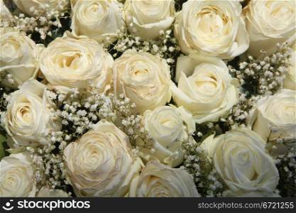 A floral arrangement made off white roses and white Gypsophila or Baby&rsquo;s Breath