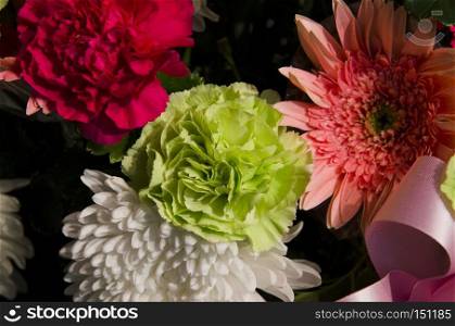 A flower bouquet with a lot of different flowers