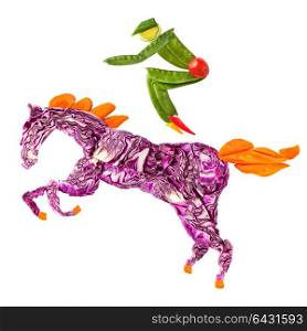 A food concept of a horse rider made of fruits and vegs isolated on white.
