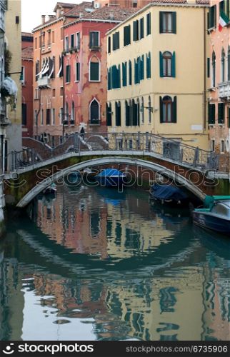 A foot bridge over a canal, Venice, Italy