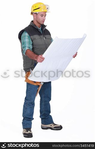 A foreman checking blueprints.