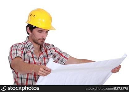 A foreman checking plans.