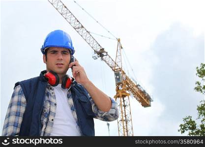A foreman on his phone onsite.
