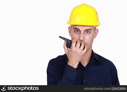 A foreman talking over the phone.