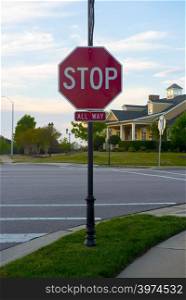 a fourway stop sign at an intersection