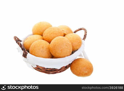 A fresh basket of golden brown hard crusted buns. Shot on white background.