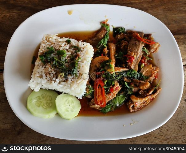 A fresh dish of Thai style food, Fried pork with sweet basil and white jasmine sticky rice