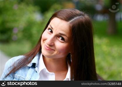 A Fresh Faced Girl With a beautiful face and green background