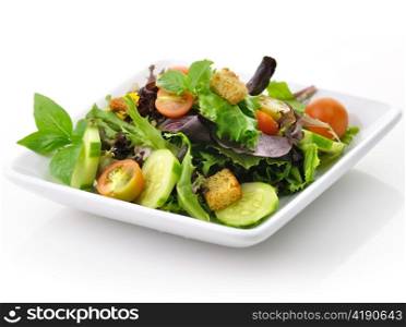 a fresh vegetable salad in a white dish