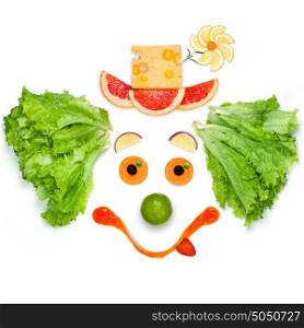 A friendly clown made of vegetables and sauce.