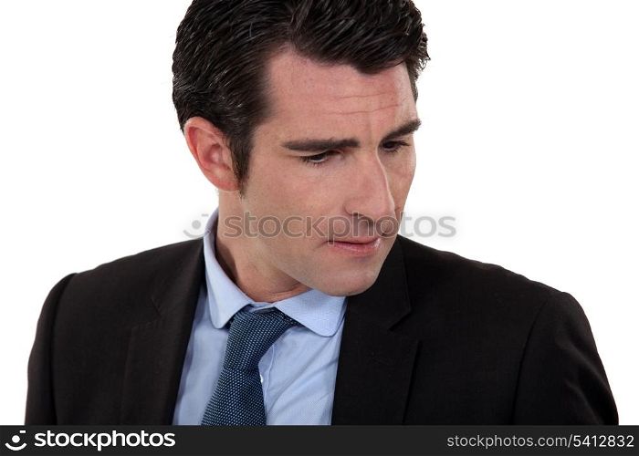 A frowning businessman