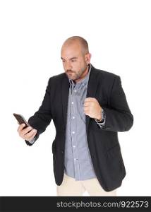 A frustrated middle age Hispanic man looking puzzled at his cell phone can not believe what he is seeing, isolated for white background