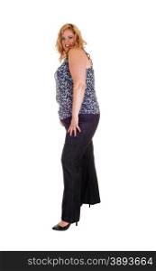 A full body picture of a plus size woman standing isolated for whitebackground in jeand and high heels.