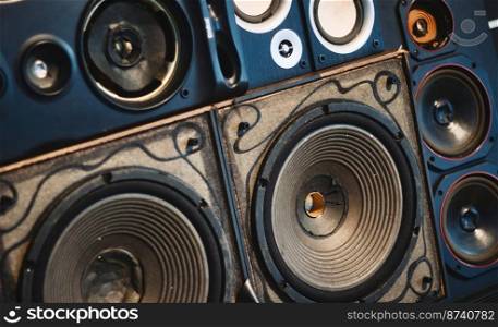A full-frame wall of old retro speaker cones background concept for music and audio industry